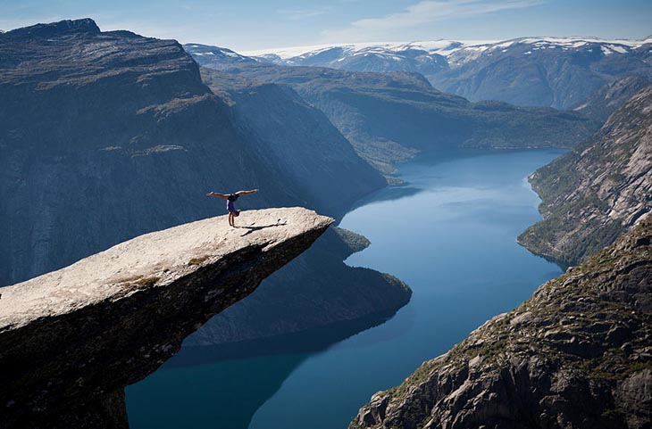 Aerobics on Trolltunga rock in Norway