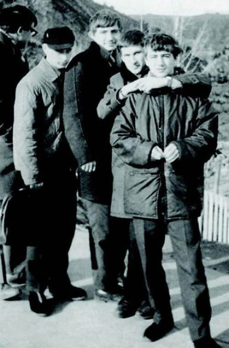 Vladimir Putin as a teenager (2nd from the left, in a hat)