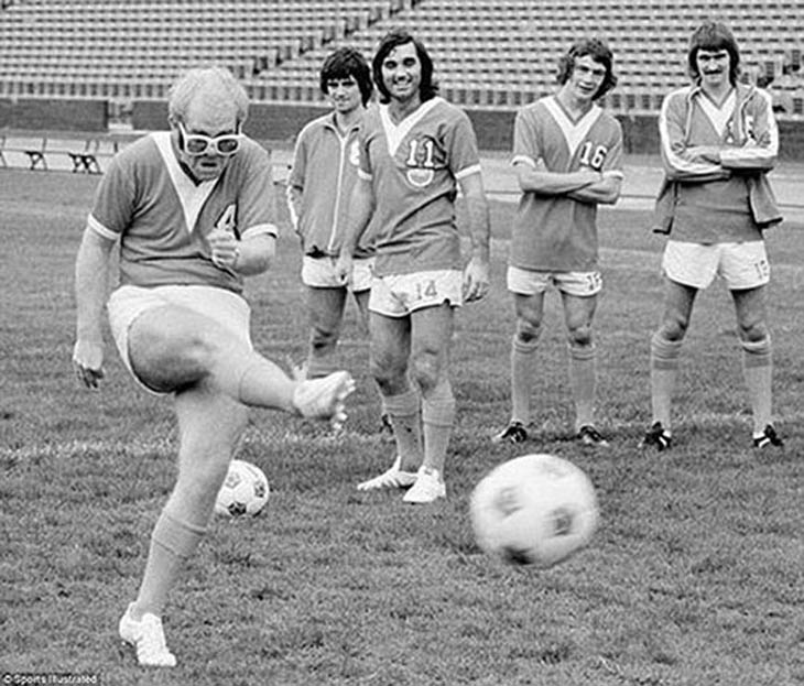 Elton John showing off his football skills, 1976