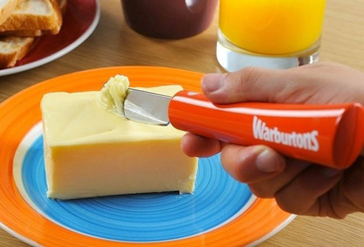 Heated butter knife that slices through cold spreads smoothly.