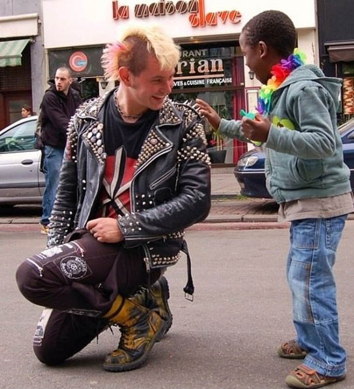 Punk rocker and kid at a Gay Pride parade