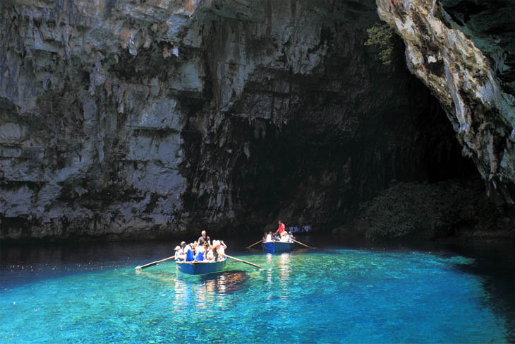 Rowing through a dark cave in Kefalonia, Greece.