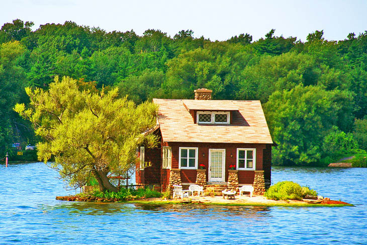 House in the lake with cool porch in Thousand Islands, Canada.