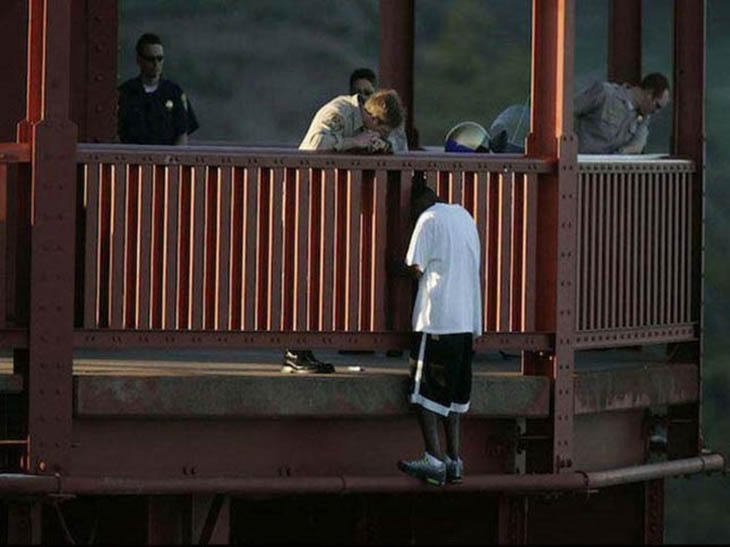 evin Berthia is talked out of jumping off the Golden Gate Bridge by police officers.