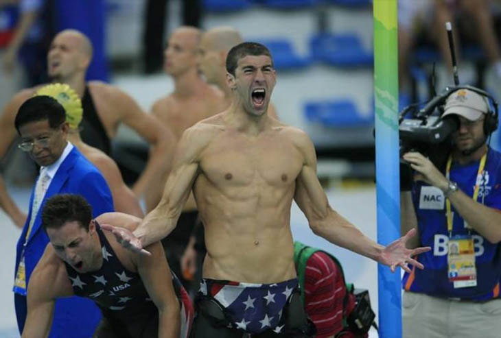 Michael Phelps celebrates after winning his 14th gold medal, setting the all-time record for most Olympic gold medals. [2008]