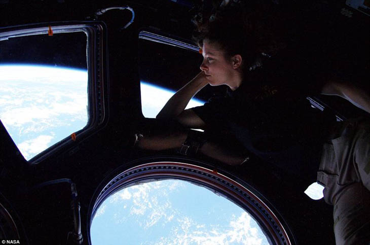 Tracy Caldwell looks down on Earth from the International Space Station [2010]