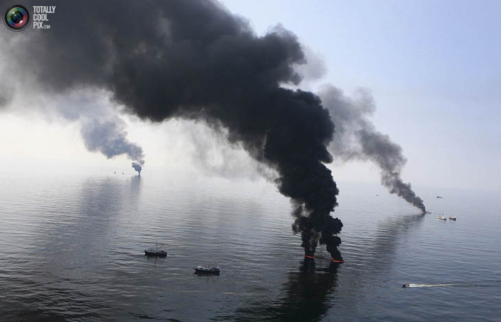 Smoke billows from a controlled burn of spilled oil off the Louisiana coast