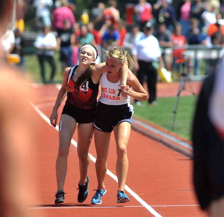 Meghan Vogel, a high school runner, helps her exhausted rival cross the finish line. [2012]