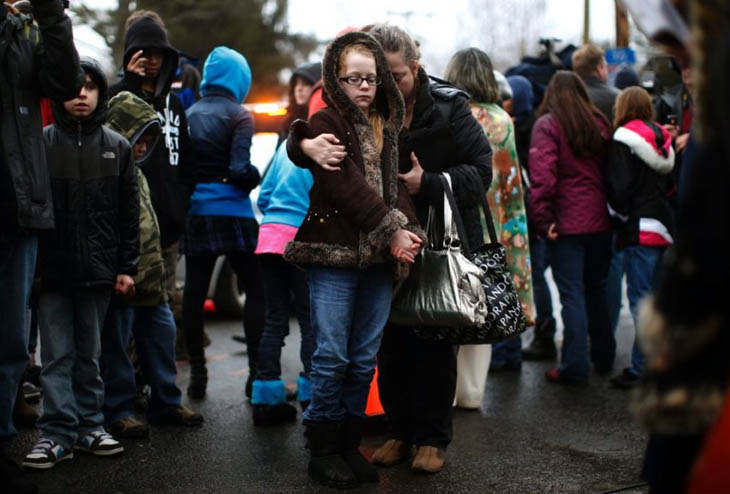 A mother comforts her daughter after the Sandy Hook shootings [2012]