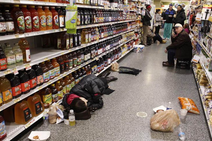 People hang out in a Publix grocery store after being stranded due to a snow storm in Atlanta, Georgia.