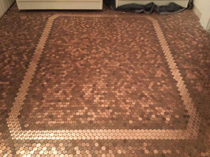 After gluing 20,000 pennies, the penny floor project was complete.