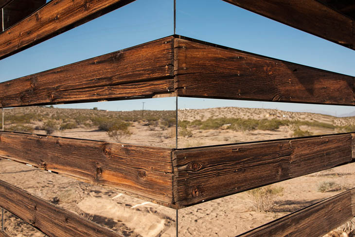 Look how Phillip arranged strip of mirror in between weathered board.