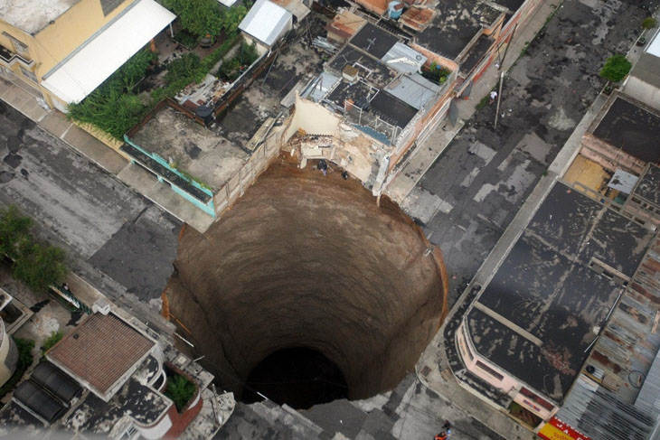 An actual 60 feet wide and 200 feet deep sinkhole in Guatemala City in 2010.