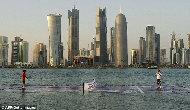 Rafael Nadal and Roger Federer are actually playing tennis on a water court.