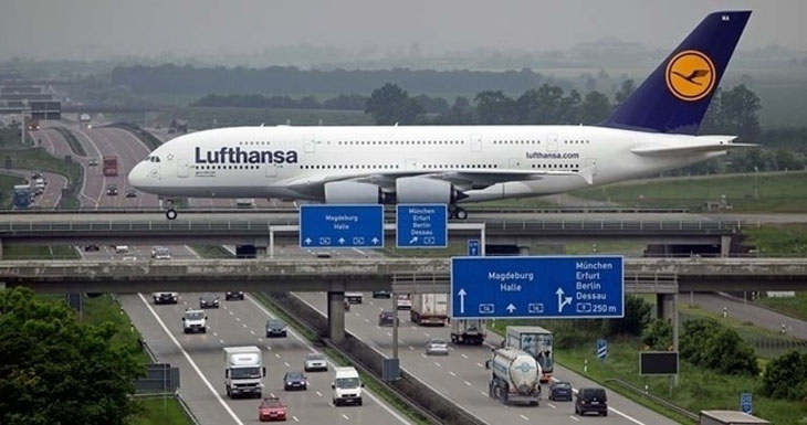An actual plane landing at Liepzig airport as it crosses over the Autobahn.
