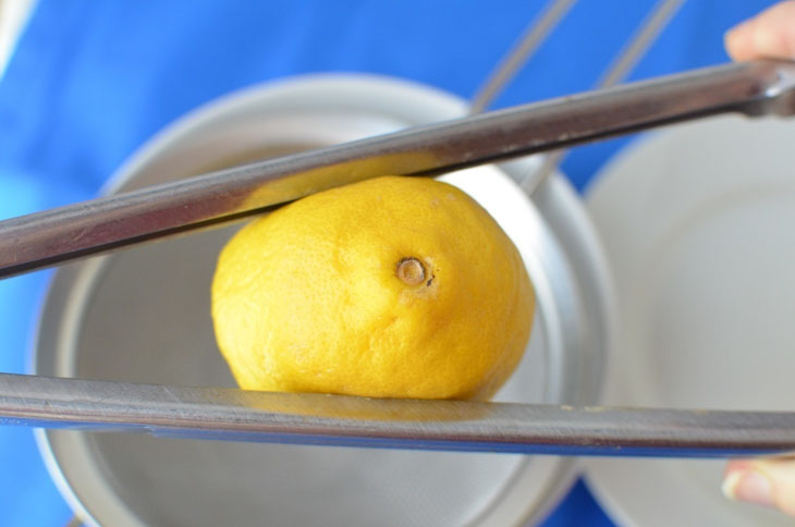 Use tongs to squeeze your lemons.