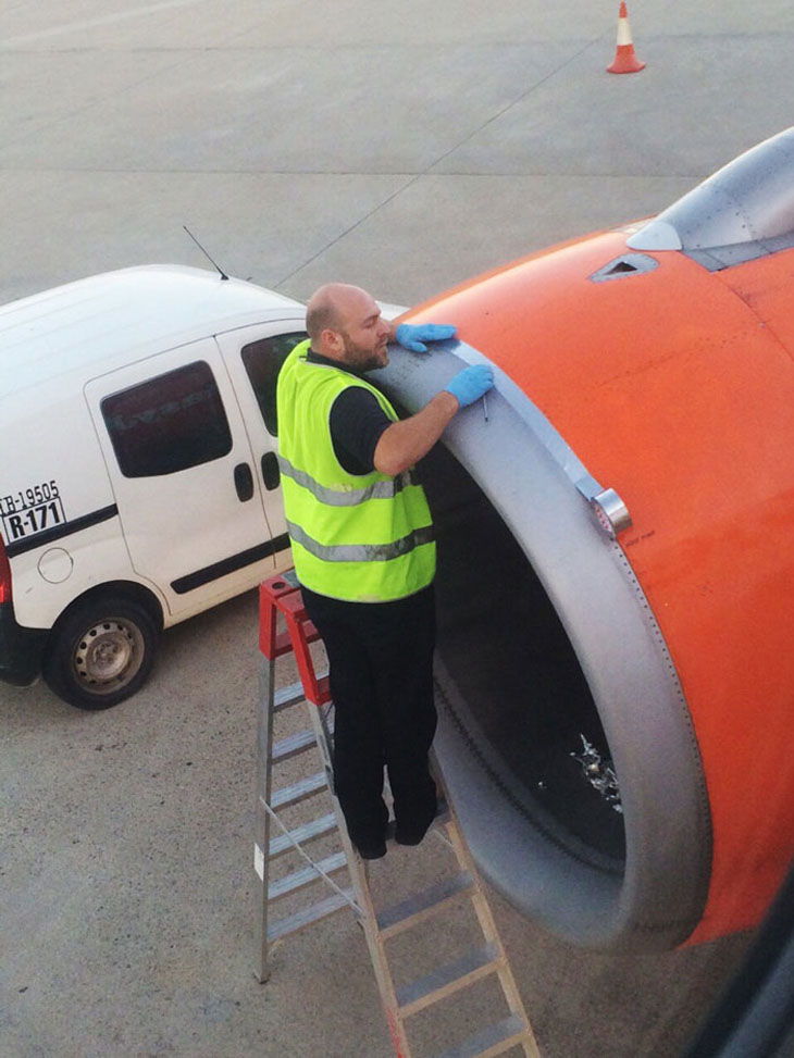 Airplane Passenger Spots Worker Fixing Jet Engine With Tape Before Take-off